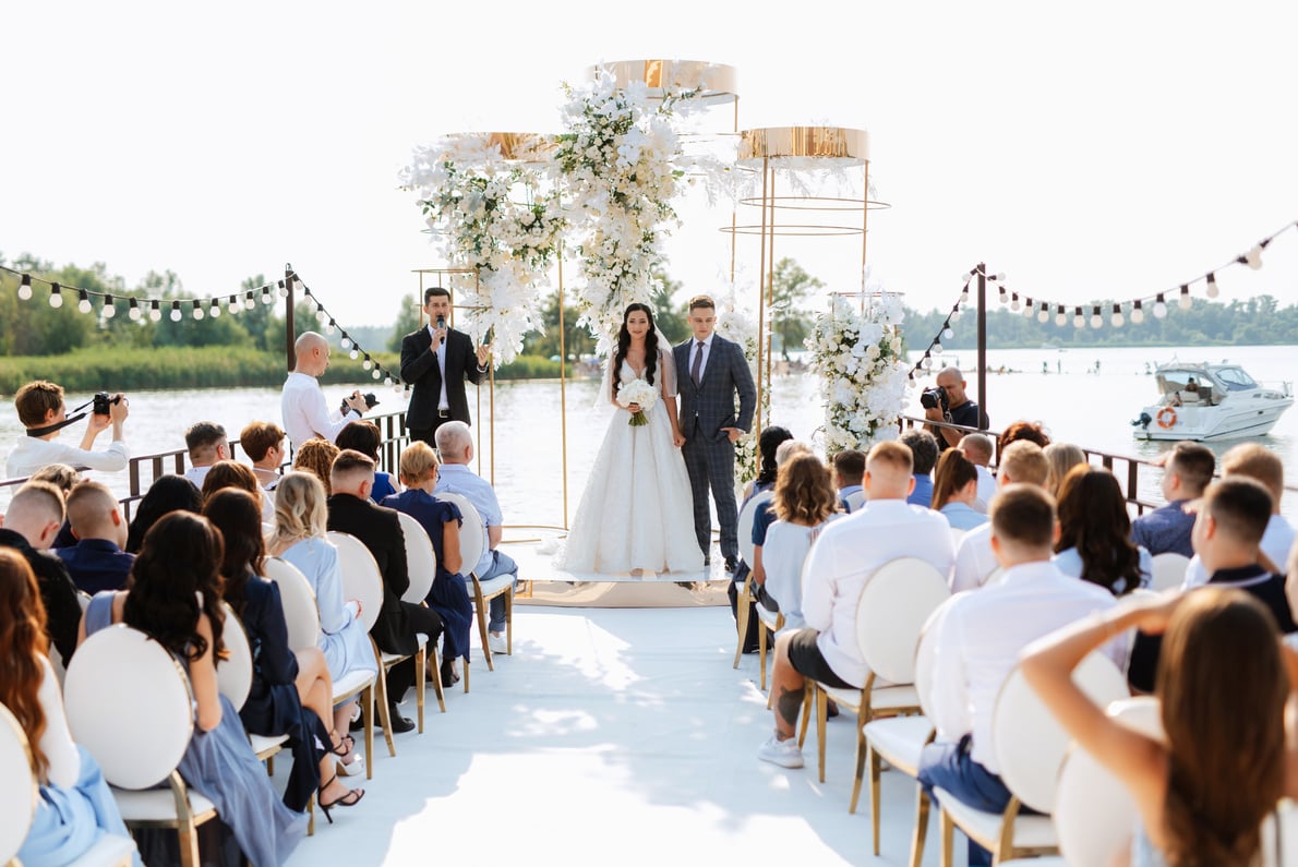 wedding ceremony of the newlyweds on the pier